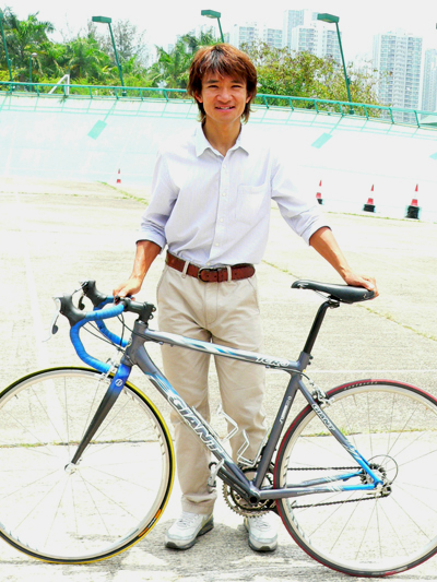 Wong Kam Po, the world cycling champion with his favorite bicycle.
