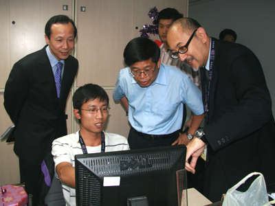 Mr. Tang shows great interest in the operation.