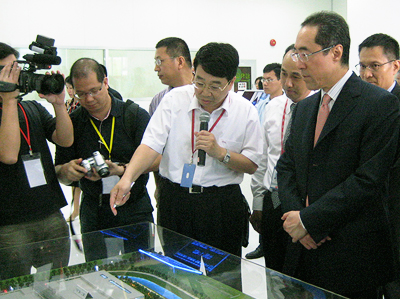 Mr. Henry Tang visiting a local enterprise in Huizhou