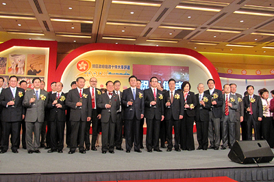 Mr. Donald Tsang, Chief Executive of the Hong Kong SAR and Mr. Li Gang, Director of the Liaison Office of the Central People's Government in the HKSAR (front row, seventh from left) on stage with representatives of the organizers proposing a toast.