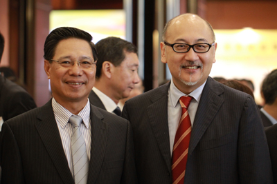 Mr. Kit Szeto with H.E. Dr. Nam Viyaketh, Minister of Industry and Commerce of Laos.