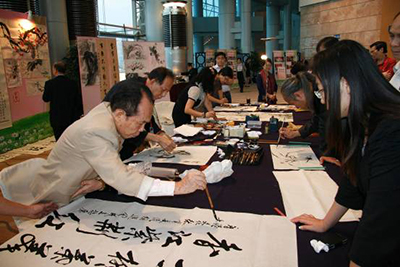 Calligraphers and painters displaying their artistic skills at the event