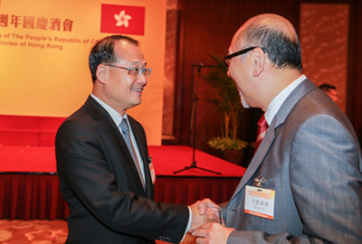 Mr. Kit Szeto exchanging greetings with Mr. Jonathan Choi Koon Shum, Deputy Director of the Committee for Education, Science, Culture, Health and Sports of the Chinese People’s Political Consultative Conference and Chairman of the Sunwah Group. 