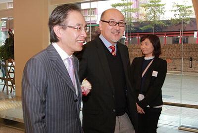 Mr. David M.H. Fong, BBS, JP, Managing Director of the Hip Shing Hong Group of Companies (left) welcoming Mr. Kit Szeto to the opening.   