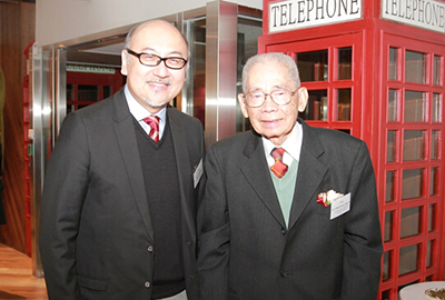 Mr. Kit Szeto congratulating respected philanthropist Dr. Henry Y.W. Fong on the opening of Genesis.    
