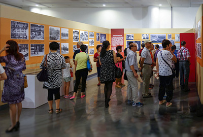 Visitors viewing the wartime photos on display